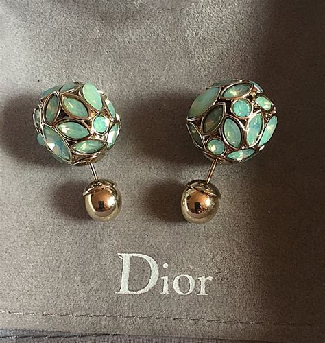 dior tribal style earrings.